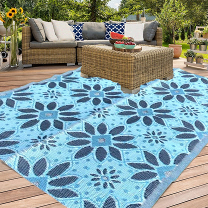 outdoor plastic straw patio rug in blue colour flower designed