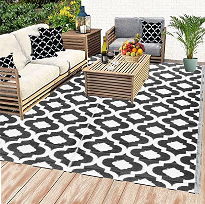 Outdoor Plastic Straw patio Rug in black & white Colour of BalajeesUSA brand  used in balcony under the sofa and table 